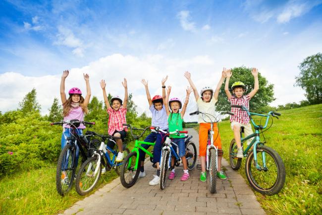 excited-kids-helmets-bikes-hands-up-sitting-their-air-43447134.jpg