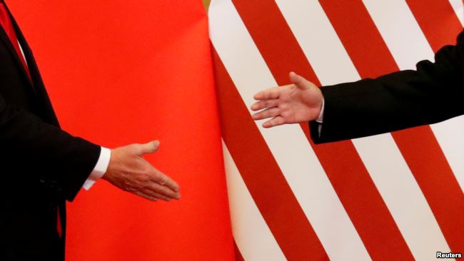 Xi Trump shaking hands Nov 2017
