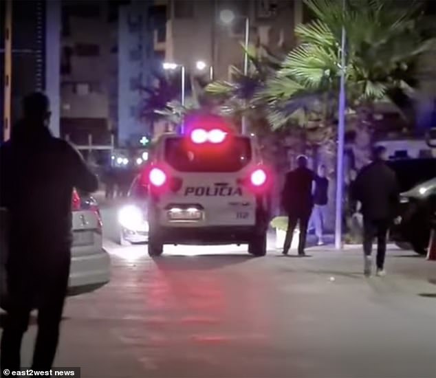 Albanian police said four Russian holidaymakers were found asphyxiated in a hotel sauna in the village of Qerret late on Friday (Pictured: Police arriving to the scene)