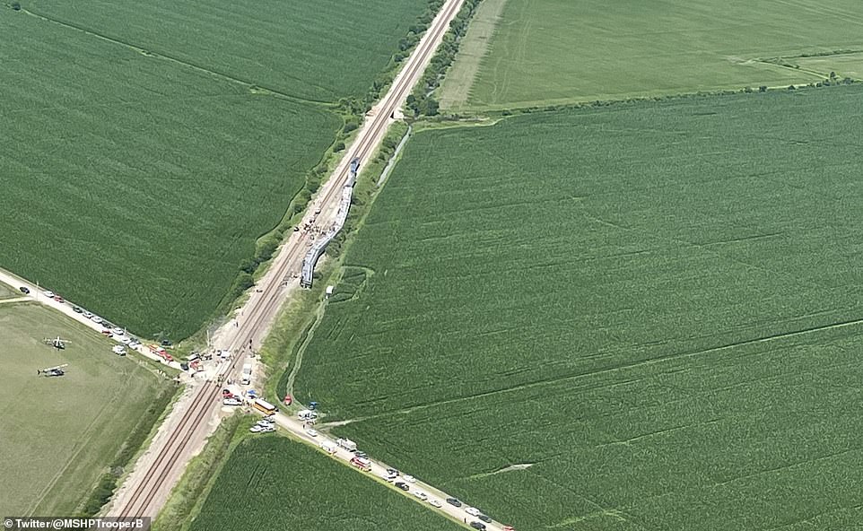 The derailment is seen in an aerial image. The federal National Transportation Safety Board is deploying a 14-member 'go-team' to the site of the derailment to investigate