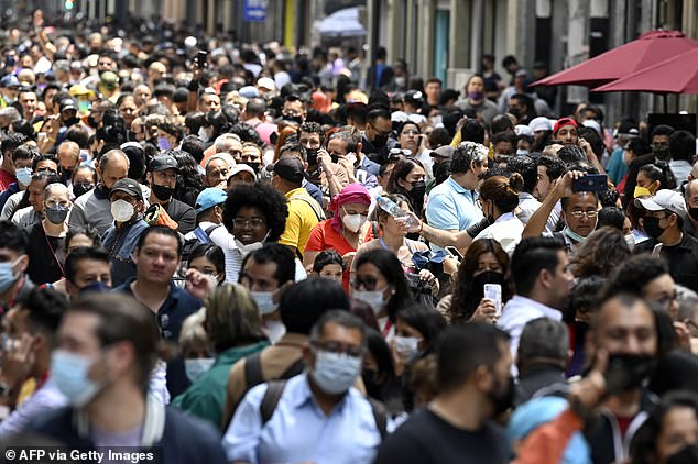People rush on to the street after an earthquake in Mexico City on September 19, 2022