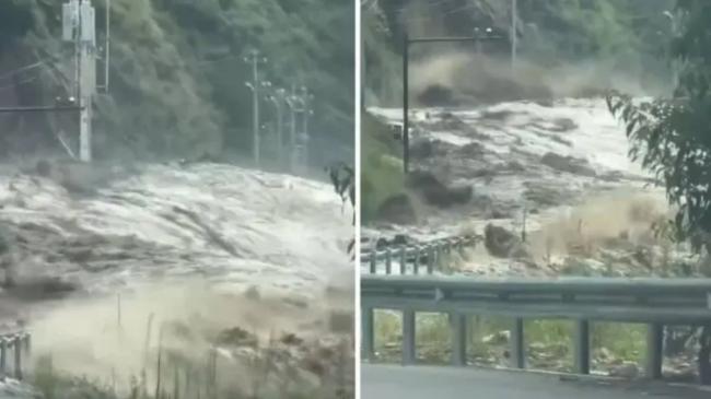 西藏泥石流游客目睹山洪来袭 惊险倒车逃出生天